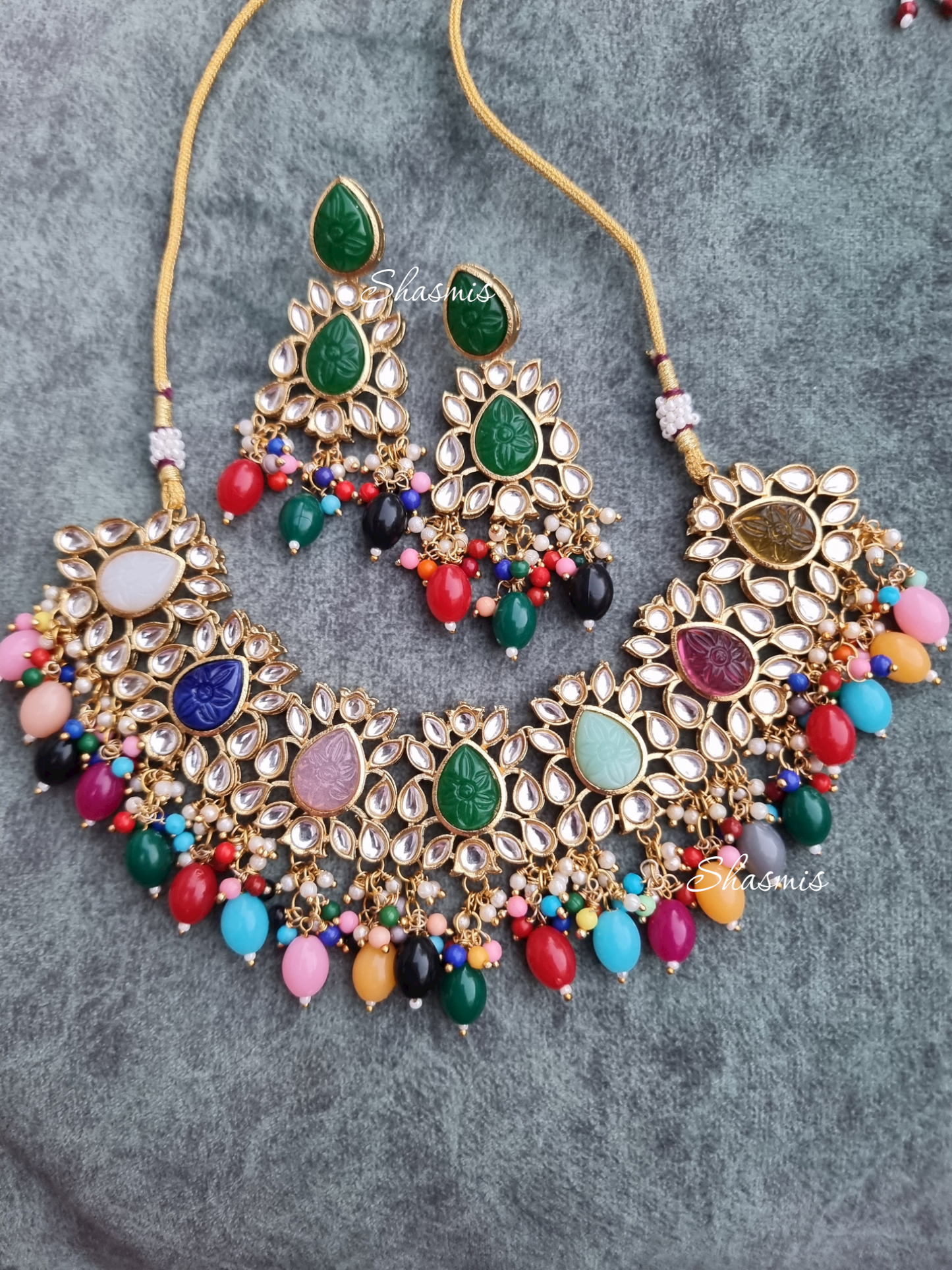 Kundan Stones Necklace And Earrings With Pearl On Drop And Almond shape Carved Stones