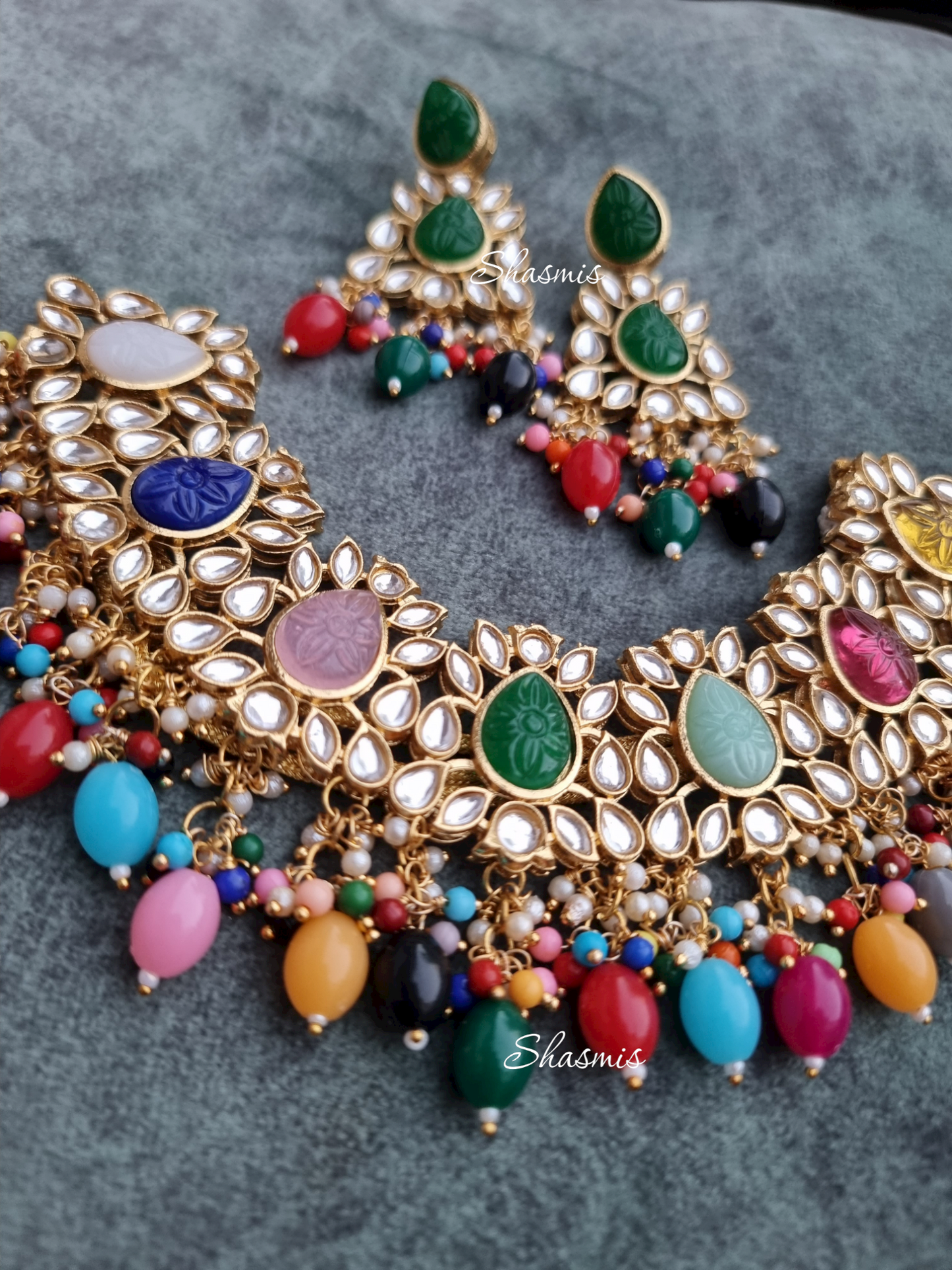 Kundan Stones Necklace And Earrings With Pearl On Drop And Almond shape Carved Stones