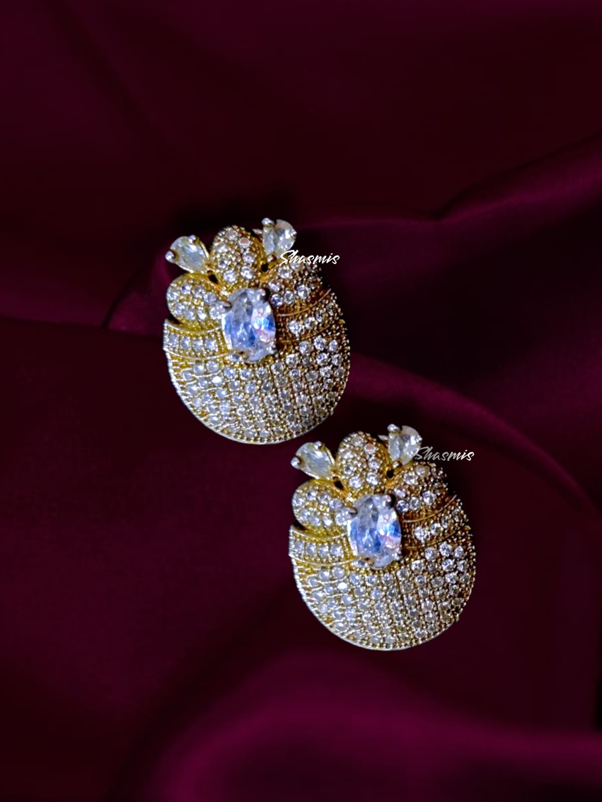 Gold Finish American Diamond Earrings With White Centre Stone