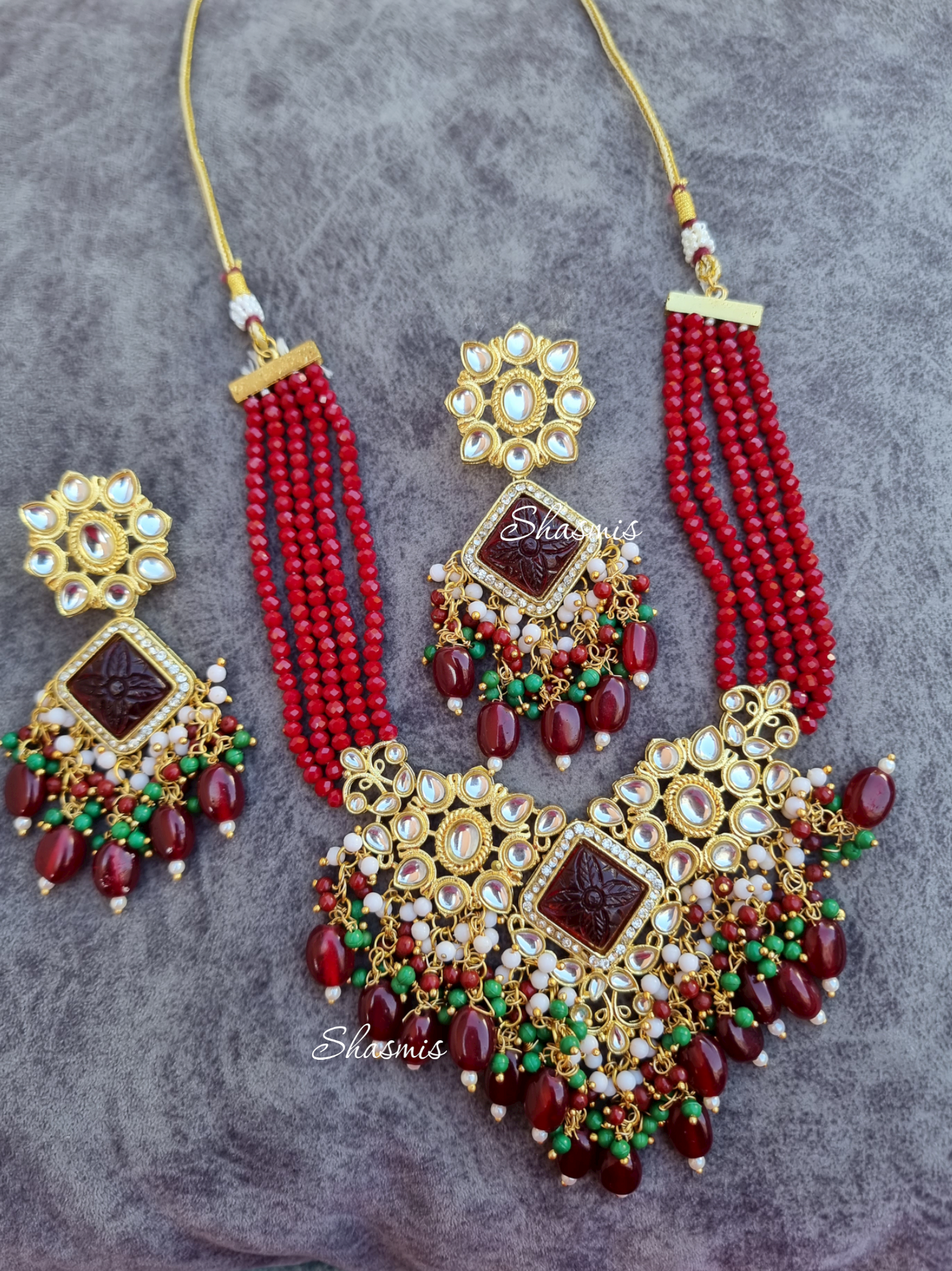 Maroon Color Kundan Necklace With Carved Stone and Earrings