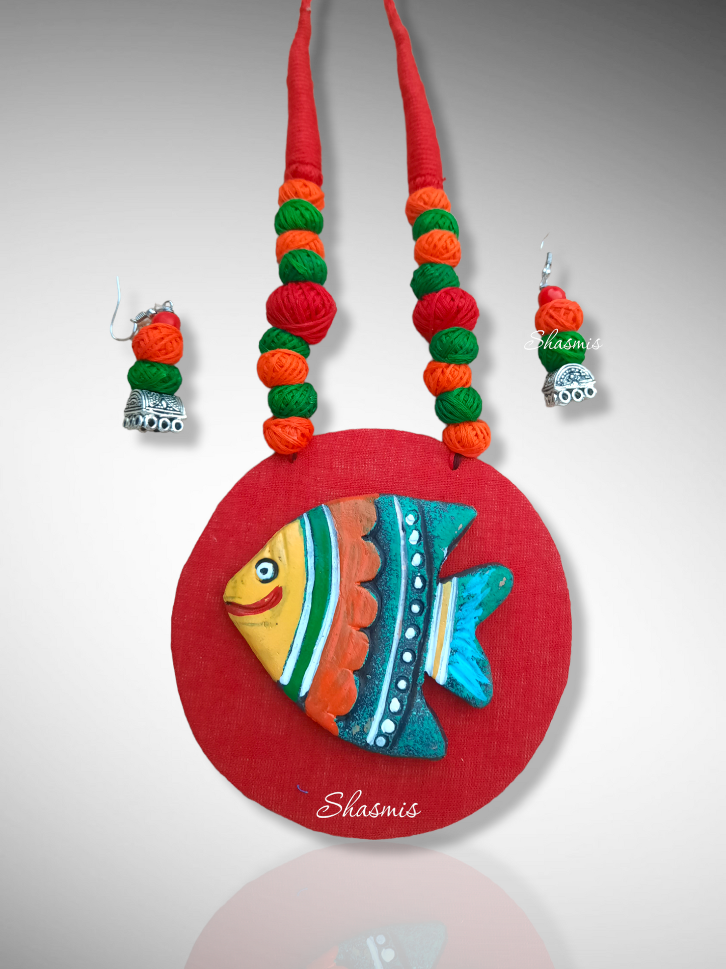 Fabric Jewellery With Fish Design Clay Work 