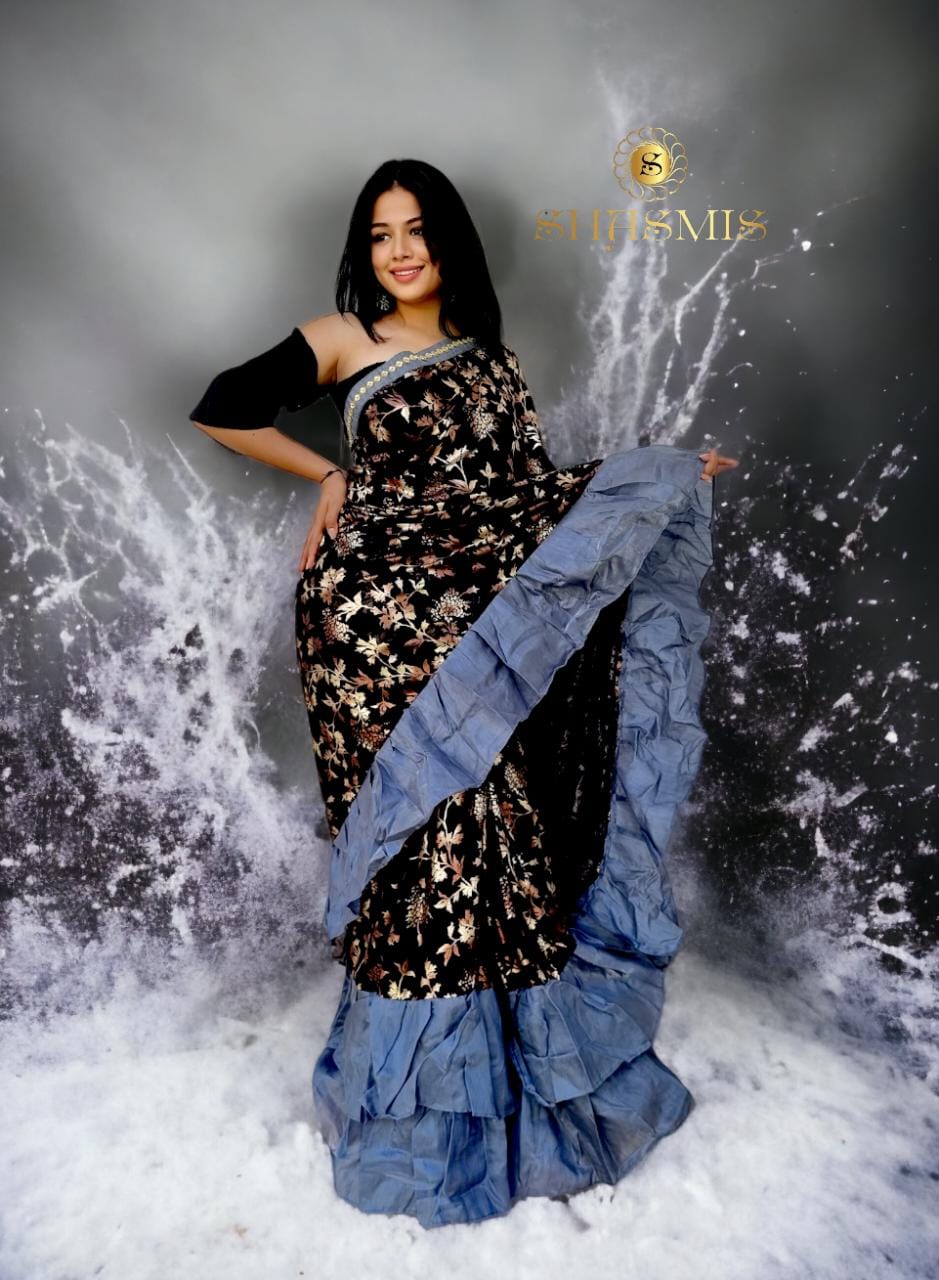 Black Color Saree With Golden Design And Grey Color Ruffle